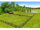 Aerial view of a horse paddock with a shelter and a pond at 1351 Highway 324 None, Rock Hill, SC 29730