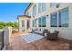 Outdoor patio with wicker furniture with clear view of the tree line, and white brick exterior at 1351 Highway 324 None, Rock Hill, SC 29730