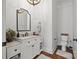 A stylish powder room features a marble countertop, white vanity, and elegant fixtures at 1351 Highway 324 None, Rock Hill, SC 29730