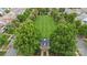 Aerial view of a house surrounded by lush trees and a sprawling lawn at 13714 Jacks Ln, Pineville, NC 28134