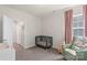 Cozy Bedroom features a green crib, plush chair, and soft natural light from the window at 13714 Jacks Ln, Pineville, NC 28134