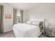 Calm and serene bedroom featuring a comfortable bed, soft carpet, and view of the neighborhood at 13714 Jacks Ln, Pineville, NC 28134