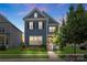 Charming two-story home featuring well-manicured lawn, lush greenery, and inviting front porch at 13714 Jacks Ln, Pineville, NC 28134