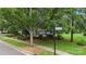 Street sign for Founders Park and Meadowside Lane in a lush neighborhood at 13714 Jacks Ln, Pineville, NC 28134