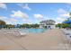 Community pool features ample lounge chairs and a spacious deck for relaxing at 13714 Jacks Ln, Pineville, NC 28134