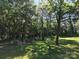 Private backyard featuring a custom pergola with a cozy fire pit offering the perfect outdoor relaxation spot at 1495 Carson Rd, Cleveland, NC 27013
