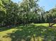 Private backyard featuring a custom pergola with a cozy fire pit offering the perfect outdoor relaxation spot at 1495 Carson Rd, Cleveland, NC 27013