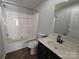 Bathroom showing vanity with dark cabinets, tub-shower combo, and a toilet at 1495 Carson Rd, Cleveland, NC 27013