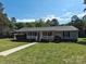 Charming single-story home with a welcoming front porch and well-manicured lawn at 1495 Carson Rd, Cleveland, NC 27013