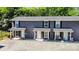 Exterior view of townhome-style condominiums with private patios and ample parking at 1512 Seigle Ave # 2, Charlotte, NC 28205