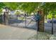 A black iron gate entrance to a gated community at 1512 Seigle Ave # 2, Charlotte, NC 28205