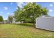 Backyard view with storage shed, partial house view, and bench at 1525 Moss Creek Dr, Harrisburg, NC 28075