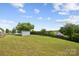 Long backyard view with storage shed and rear property line fence at 1525 Moss Creek Dr, Harrisburg, NC 28075