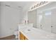 Bathroom with large mirror, vanity with wood cabinets, sink, toilet and tub shower combo at 1525 Moss Creek Dr, Harrisburg, NC 28075