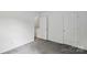 Neutral colored bedroom featuring closet, outlets, walls, doors and carpeting at 1525 Moss Creek Dr, Harrisburg, NC 28075
