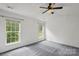 Bright bedroom with neutral walls and carpet, offering a serene atmosphere at 1525 Moss Creek Dr, Harrisburg, NC 28075