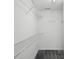 Walk-in closet provides ample storage with wire shelving and gray carpeting at 1525 Moss Creek Dr, Harrisburg, NC 28075