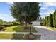 Landscaped lawn of home, with mature trees and a welcoming entrance at 1525 Moss Creek Dr, Harrisburg, NC 28075