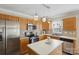 Bright kitchen with wood cabinets, stainless steel appliances, and a practical kitchen island at 1525 Moss Creek Dr, Harrisburg, NC 28075