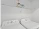 Laundry room with a washer and dryer plus wire shelving for storage at 1525 Moss Creek Dr, Harrisburg, NC 28075