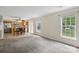 Open floor plan shows living room to kitchen with stainless appliances and updated lighting at 1525 Moss Creek Dr, Harrisburg, NC 28075
