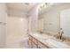 Bathroom with a tub and shower combination and double sinks at 16017 Woodcote Dr, Huntersville, NC 28078