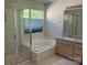 Bathroom featuring double sinks, granite countertops, bathtub, and glass shower at 16017 Woodcote Dr, Huntersville, NC 28078