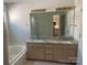 Bathroom featuring double sinks, granite countertops, bathtub and walk in shower at 16017 Woodcote Dr, Huntersville, NC 28078