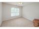 Bedroom with carpet, ceiling fan and a large window at 16017 Woodcote Dr, Huntersville, NC 28078