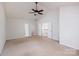 Large bedroom with vaulted ceiling, neutral carpet and doorways to other rooms at 16017 Woodcote Dr, Huntersville, NC 28078
