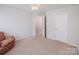 Bedroom with carpet, open doorway and two closets at 16017 Woodcote Dr, Huntersville, NC 28078