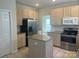 Functional kitchen with granite countertops, stainless steel appliances, and a convenient center island at 16017 Woodcote Dr, Huntersville, NC 28078
