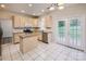Bright kitchen featuring stainless steel appliances, granite countertops, and a center island at 16017 Woodcote Dr, Huntersville, NC 28078