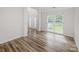 Bright living room featuring wood flooring, large window and trim work at 16017 Woodcote Dr, Huntersville, NC 28078