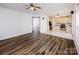 Spacious layout with hardwood flooring, seamlessly connecting the living room, kitchen, and foyer at 16017 Woodcote Dr, Huntersville, NC 28078