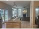 Open-concept living area featuring a fireplace, backyard access, and seamless integration with the kitchen at 16017 Woodcote Dr, Huntersville, NC 28078