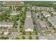 Aerial view showcases the community's pool, clubhouse, recreational area, garage, and ground floor unit at 16610 Amberside E Rd, Cornelius, NC 28031