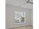 Well-lit bedroom featuring new wood-look floors, neutral walls, and a large window with blinds at 16610 Amberside E Rd, Cornelius, NC 28031