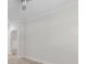 A simple bedroom with new wood-look floors leading to an open doorway at 16610 Amberside E Rd, Cornelius, NC 28031