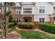 Charming exterior view of townhome featuring well-maintained landscaping and inviting entrance at 16610 Amberside E Rd, Cornelius, NC 28031