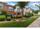 Charming townhome with manicured lawn and inviting covered entrance in a well-maintained community at 16610 Amberside E Rd, Cornelius, NC 28031