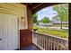 Welcoming front porch features brick accents and a serene view of the landscaped surroundings at 16610 Amberside E Rd, Cornelius, NC 28031