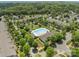 Aerial view of a neighborhood pool area with a gazebo, lounge chairs and well manicured landscaping at 16610 Amberside E Rd, Cornelius, NC 28031