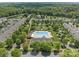 Aerial view of a neighborhood pool area with a gazebo, lounge chairs and well manicured landscaping at 16610 Amberside E Rd, Cornelius, NC 28031