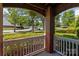 Charming front porch boasts brick pillars and white railings with views of the street at 16610 Amberside E Rd, Cornelius, NC 28031
