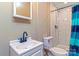 Bathroom featuring tiled shower, vanity with sink, and modern fixtures at 209 W Marsh St, Salisbury, NC 28144