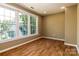 Bedroom featuring wood-look floors, neutral walls, lots of natural light from multiple large windows at 209 W Marsh St, Salisbury, NC 28144