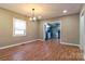 Bright dining room with wood floors and modern light fixture at 209 W Marsh St, Salisbury, NC 28144