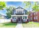 Charming two-story home with a covered porch and a cozy balcony above at 209 W Marsh St, Salisbury, NC 28144