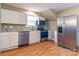 Modern kitchen with stainless steel appliances, granite countertops and cabinetry at 209 W Marsh St, Salisbury, NC 28144